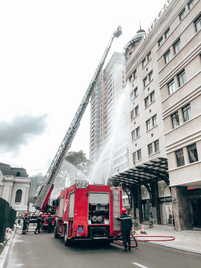 Firefighters extinguish flames in a high-rise building in Ho Chi Minh City, showcasing bravery and teamwork.
